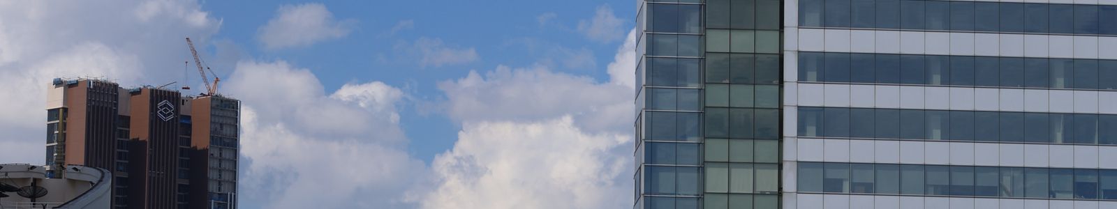 Modern glass skyline representing SAPMavens enterprise-grade delivery